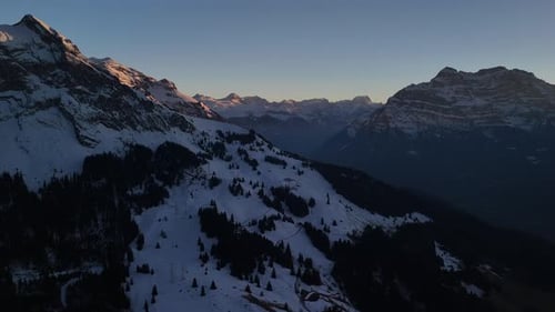 Aerial Fronalpstock Switzerland alpine snow covered valley hills drone landscape