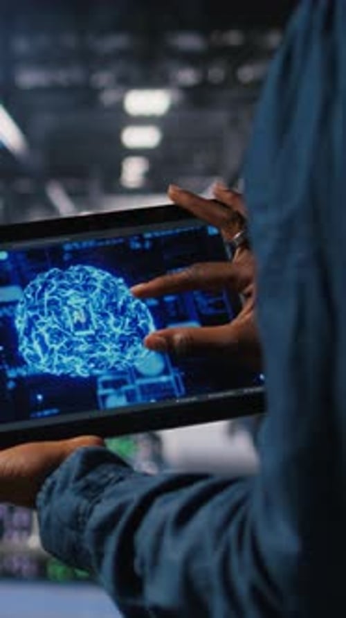 Vertical Video Close Up of Server Farm Admin Using Tablet to Do AI Automatization