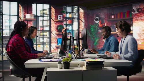 Busy Call Center Employees Working at Computers