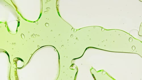 Abstract Green Liquid Flowing With Bubbles