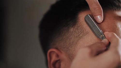 Man's Hairline Edged Up with Straight Razor
