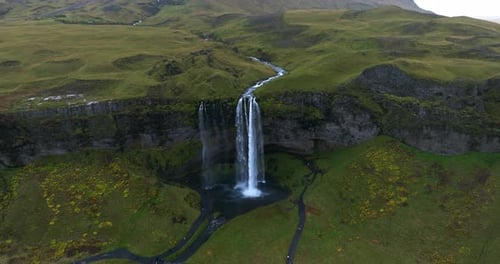 Seljalandsfoss Waterfall In Scenic Landscape Of Iceland - Aerial Pullback