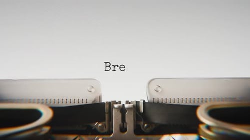 Old mechanical typewriter typing Break Time in a close-up view.