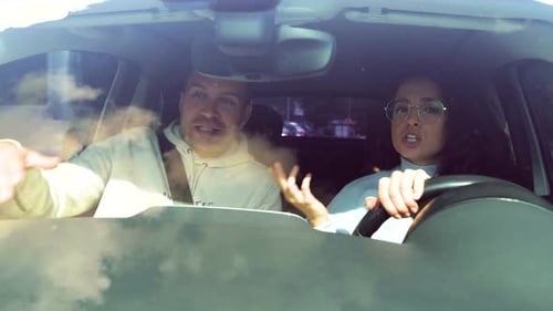 Couple Arguing in a Car, Woman Driving