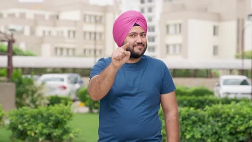 Enthusiastic Man Giving Double Thumbs Up Outdoors