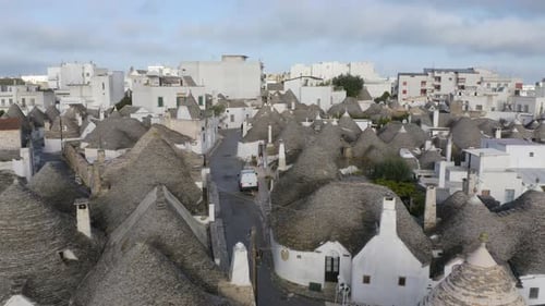 Cinematic Establishing Drone Shot Above Trulli di Alberobello, Apulia, Italy