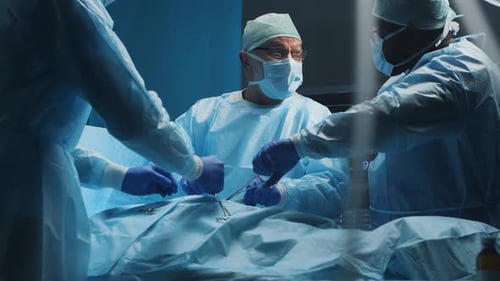 Surgeons Performing Operation in Hospital Operating Room