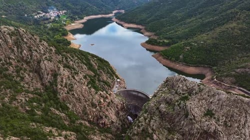 Exploring the stunning landscape around a reservoir and dam in the mountains