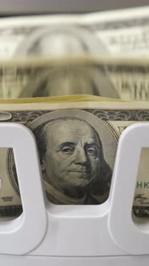 Counting process of dollar banknotes. Automated financial operations