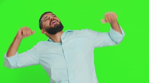 Bearded Man Dancing in Front of Green Screen