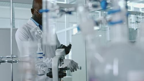 Scientist Using Microscope in Modern Laboratory