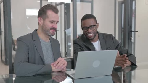 Businessmen Having a Video Conference in a Modern Office