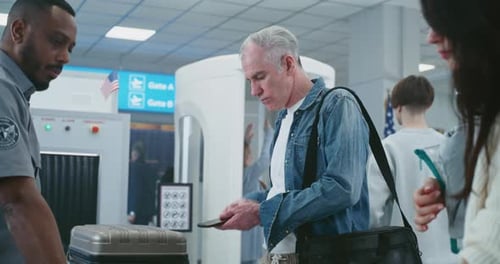 Security Check in Airport Diverse People Tourists Putting Personal Items Bags for Xray Scanning