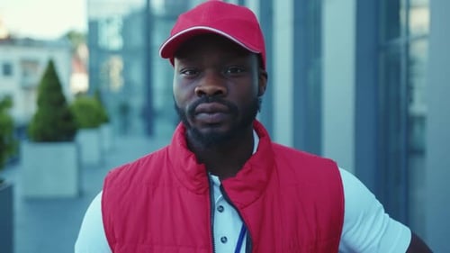 Close Up Portrait Young African American Delivery Man Standing at Street Holding Carton Boxes Look