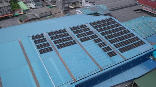 Aerial view of solar cell panels installed on roof of the factory
