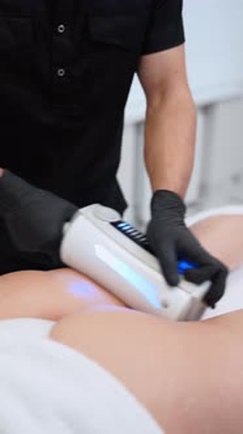 Professional Performs Endospheres Therapy Massage on Womans Thigh for Cellulite Reduction in Spa