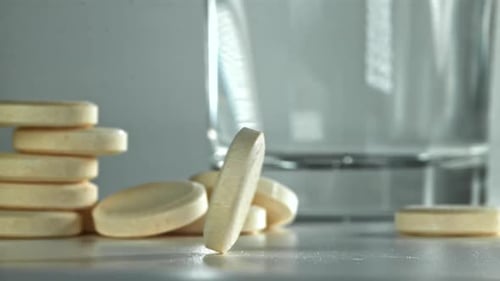 An Aspirin Tablet on the Table Filmed on a Highspeed Camera at 1000 Fps