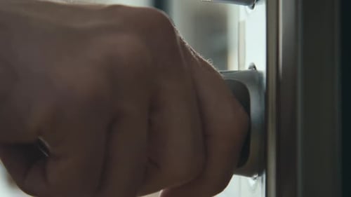 Hand Opening Modern Door in Natural Light