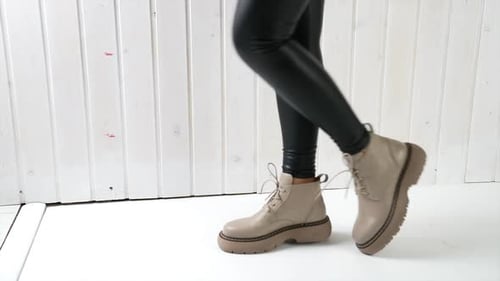 Close Up of Legs Wearing Fashionable Boots