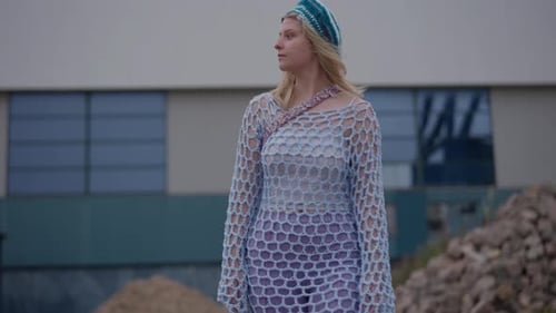 Young Adult Poses in Knit Dress and Hat