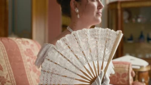 Woman in White Gown with Fan