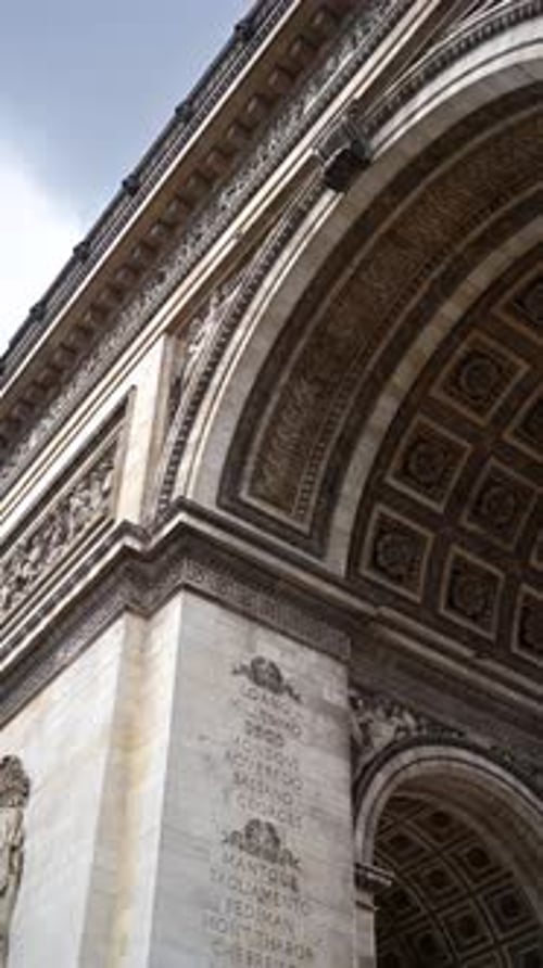 Paris, France - June 18, 2024: Close up view Of The Arc De Triomphe. Vertical