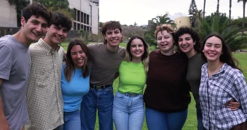 Young Group of Friends Having Fun Outdoor with University on Background Adolescence