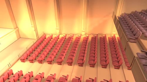 Modern Auditorium with Red Seats and Warm Lighting