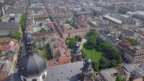 Aerial shot of the modern buildings near an old German palace, 4k