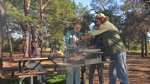 Group of Friends Enjoying a Barbecue in the Park