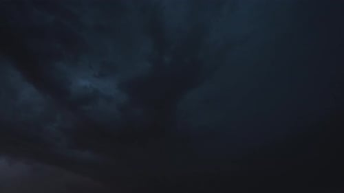 Storm Clouds at Night with Lightning Flashes