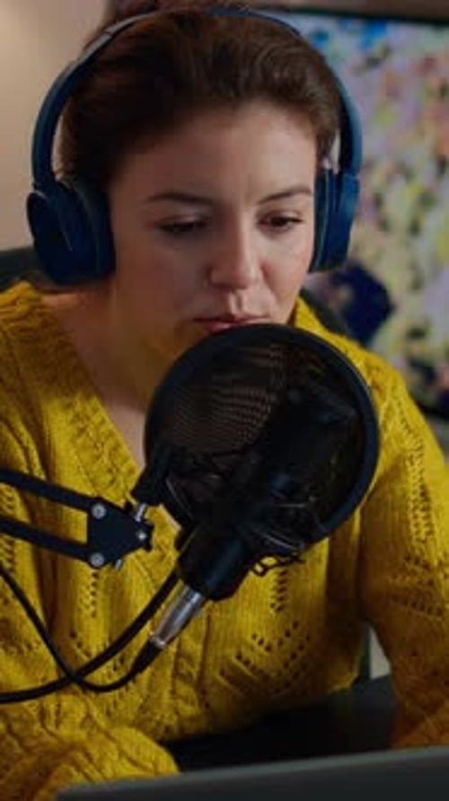 Vertical Video Vlogger Looking at Laptop While Asking Audience to Subscribe on Her Channel