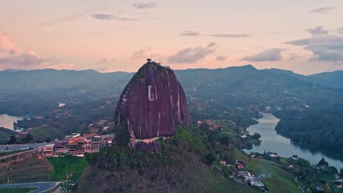 Aerial view of La Piedra del Peñol monolith and lake at sunset – Guatapé, Medellín, Colombia