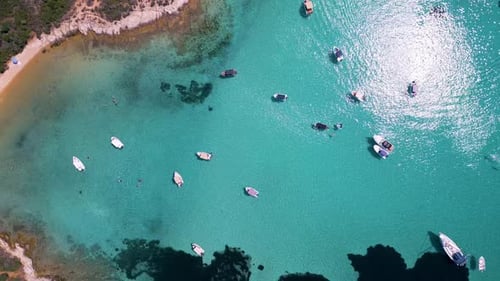 Aerial View of Boats Anchored in Shallow Turquoise Water Near the Coast Clear Sea Swimmers and