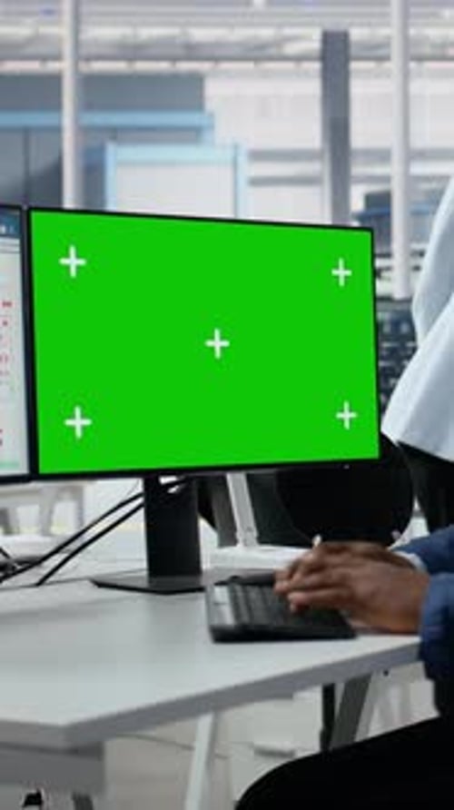 Vertical Video Green Screen PC Analyzing PCB Architecture and Man in Semiconductors Factory