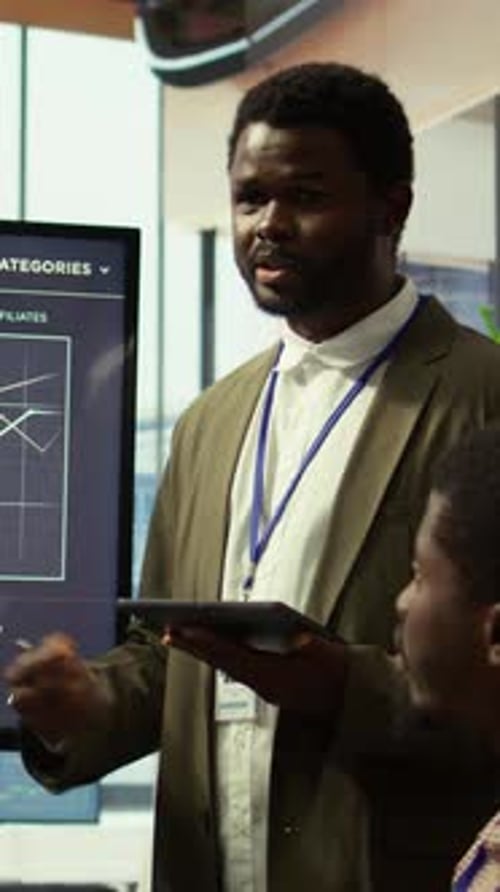 Vertical Video Coworkers Engaging in a Problem Solving Meeting at a Corporation