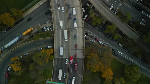 Top Down Footage of Slowly Moving Vehicles in Multilevel Road Intersection in City