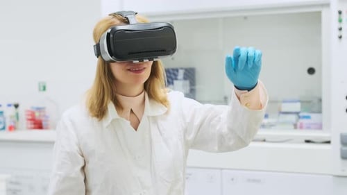 Scietist Wearing Virtual Reality Headset Augmented Reality Using 3D VR Glasses at the Laboratory