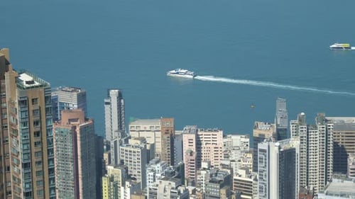 Aerial View of Coastal City With Ferries