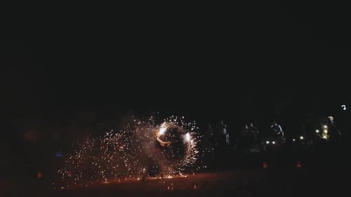 An Amazing Fire Show at Night A Woman Spinning Fire Back View of Female Artist Performing Fireshow