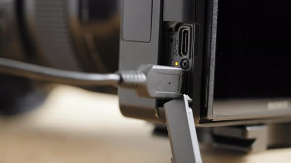 Unplugging a micro USB cable from a camera - isolated close up ...