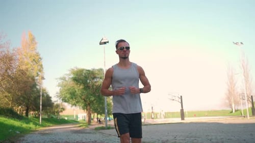 Male Jogger Running in Park