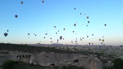 Hot Air Balloons Soaring Over Cappadocia Valley at Sunrise