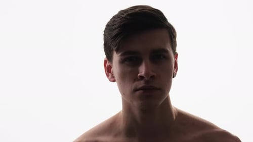 Dark Haired Young Adult Male Stares Intently