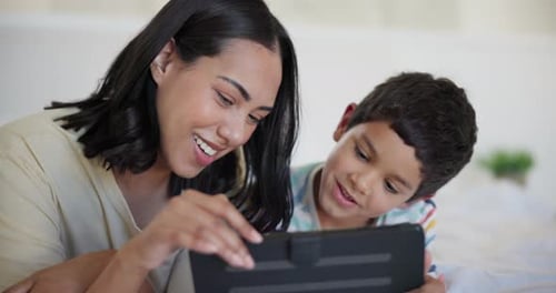 Woman and Child Using Tablet Device