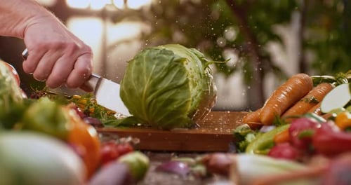 Slicing cabbage on wooden board