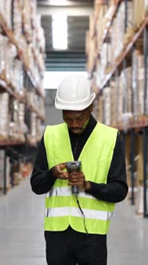 Warehouse Worker Scanning Inventory in Slow Motion