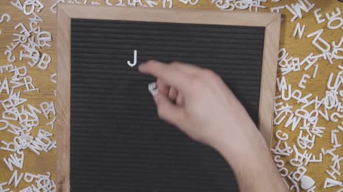 The word Jesus lettered on felt letter board