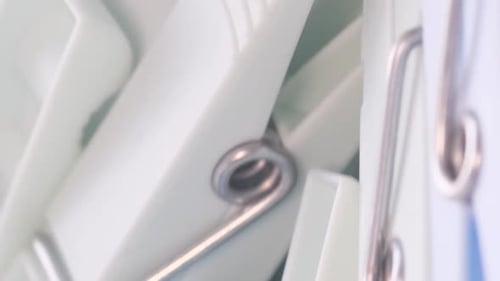 Macro Video Clothespins Rotate in a Circle Dry Clothes The Concept of Washing Clothes Vertical Video