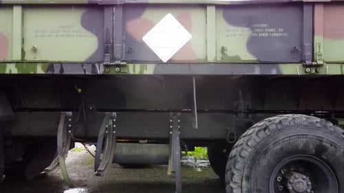 M977 Oshkosh Hemtt 8x8. The Heavy Expanded Mobility Tactical Truck aerial panramic pan to the left o